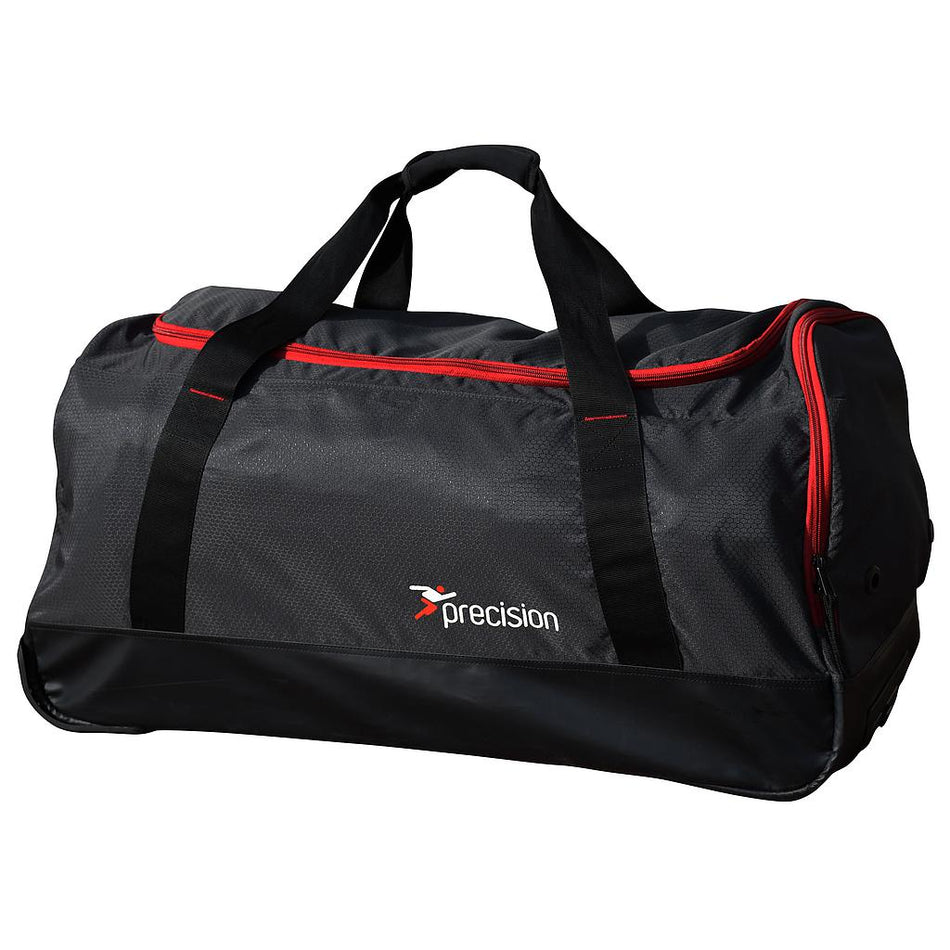 The Precision Training Pro HX Team Trolley Holdall Bag in Black/Red features red zippers, black handles, and a printed logo—an ideal durable bag for carrying your gear.