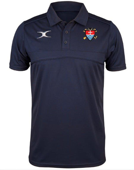 The Gilbert Teign School Photon II Senior Polo Shirt in navy features a collar, white left chest logo, and colorful crest with oars and shield on the right. Perfect for Sixth Form Sport, its moisture-wicking fabric keeps you comfortable all day.