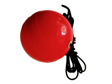 The V - Replacement Soft Training Ball (Junior) by The V, a shiny red PVC ball with a black cord, is ideal for Cricket Training Nets and shown against a white background.