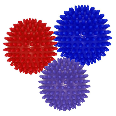 The Urban Fitness Massage Balls Set by Urban Fitness includes three spiky self-massage balls in red, blue, and purple. Each ball features evenly spaced, rounded spikes for effective muscle stimulation and back pain relief on any white surface.