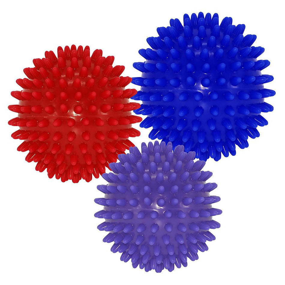 The Urban Fitness Massage Balls Set by Urban Fitness includes three spiky self-massage balls in red, blue, and purple. Each ball features evenly spaced, rounded spikes for effective muscle stimulation and back pain relief on any white surface.