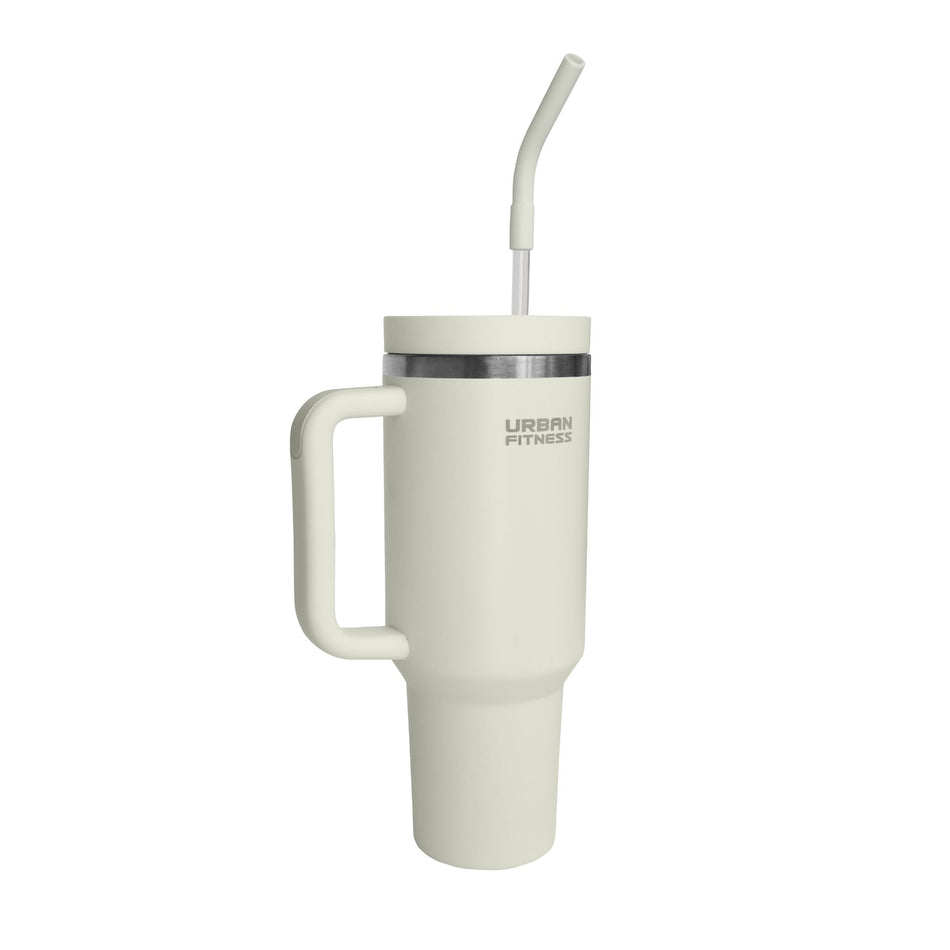 The Urban Fitness VitalSip V2 Bottle is a 1200ml cream insulated stainless steel travel tumbler with handle, silver rim, lid, and reusable straw. Double-wall vacuum insulation keeps drinks fresh. "URBAN FITNESS" printed near the top.