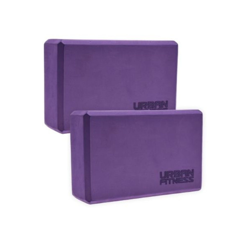 A pair of purple Urban Fitness Yoga Bricks, featuring the Urban Fitness logo on the front, set against a white background.