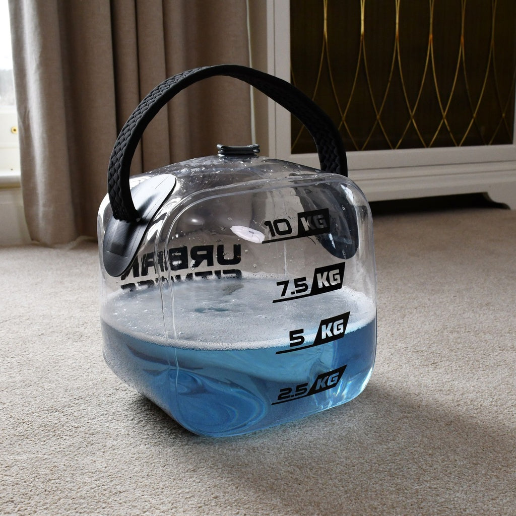 The Urban Fitness Hydro Inertia Kettlebell by Urban Fitness is a clear plastic inflatable kettlebell with a black handle and blue liquid, adjustable from 2.5 kg to 10 kg—perfect for water-based functional training at home.