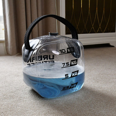 The Urban Fitness Hydro Inertia Kettlebell by Urban Fitness is a clear plastic inflatable kettlebell with a black handle and blue liquid, adjustable from 2.5 kg to 10 kg—perfect for water-based functional training at home.