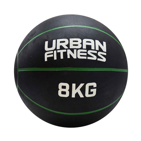 The Urban Fitness Medicine Ball, an 8KG black rubber ball with green lines and white "Urban Fitness" branding, is designed to boost explosive power and functional fitness. It's displayed against a plain white background.