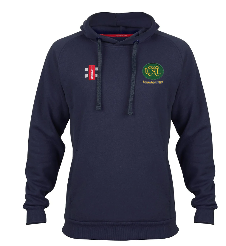 The Gray Nicolls Upton St Leonards CC Velocity Hoodie is a navy organic cotton hoodie with a drawstring, small red and white rectangular patch, yellow embroidered logo with green letters, and "Founded 1827" on the chest.