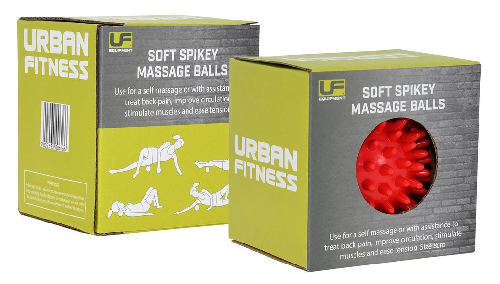 Two green Urban Fitness Soft Spikey Massage Balls boxes are shown, one open to reveal a red massage ball. The packaging by Urban Fitness displays black-and-white exercise illustrations for circulation and back pain relief.