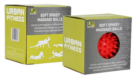 Two green Urban Fitness Soft Spikey Massage Balls boxes are shown, one open to reveal a red massage ball. The packaging by Urban Fitness displays black-and-white exercise illustrations for circulation and back pain relief.