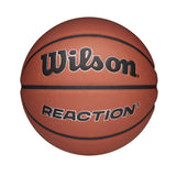 The Wilson Reaction Plus Basketball features a brown composite cover with black lines and "Wilson" boldly above "REACTION." Suitable for indoor and outdoor play, it is shown against a plain white background.
