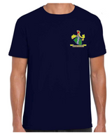 A person wears a PenCarrie Westbury-on-Severn CC Gilden Mens T-Shirt in navy, featuring the club's colorful crest—with a figure, greenery, and yellow banner—on the left chest.