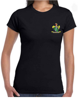 A woman wears a fitted black PenCarrie Westbury-on-Severn CC Gilden Ladies T-shirt featuring a colorful embroidered club logo crest in green, red, and yellow on the left chest with partially visible text below.