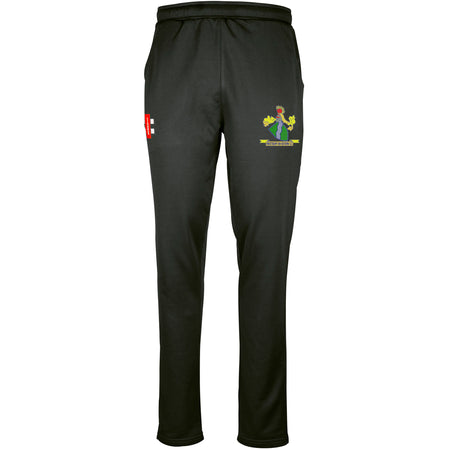 The Gray Nicolls Westbury-on-Severn CC Pro Performance Training Trousers are black with an elastic waistband, moisture-wicking fabric, a red and white NE logo on the right thigh, and a green, blue, and yellow crest on the left thigh.