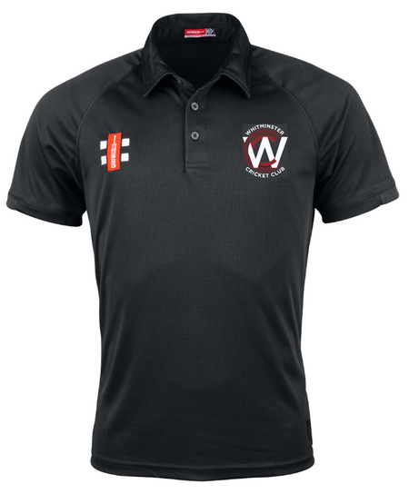 The Gray Nicolls Whitminster CC Matrix V2 Polo Shirt is a black, short-sleeved cricket top with a collar, featuring the club logo on the left chest, red rectangular sponsor logo on the right, and moisture-wicking fabric for comfort.