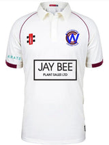 The Gray Nicolls Whitminster CC Matrix V2 Short Sleeve Match Shirt is a white, moisture-wicking cricket shirt with maroon trim, Wavertree Cricket Club logo, Jay Bee Plant Sales Ltd sponsor on the front, and a smart button collar.