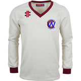 The Gray Nicolls Whitminster CC Pro Performance Sweater is a long-sleeved cream sweater with maroon collar and cuffs, club logo on the left chest, and two rectangular patches on the right shoulder.