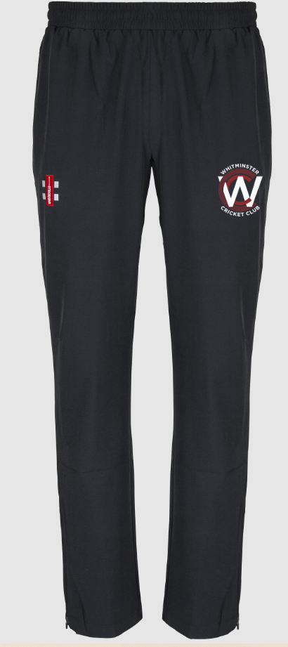 The Gray Nicolls Whitminster CC Velocity Track Trouser features an athletic fit, elastic waistband, red and white logo on the right thigh, and a circular Whitminster Cricket Club crest on the left. Ideal for active training sessions.