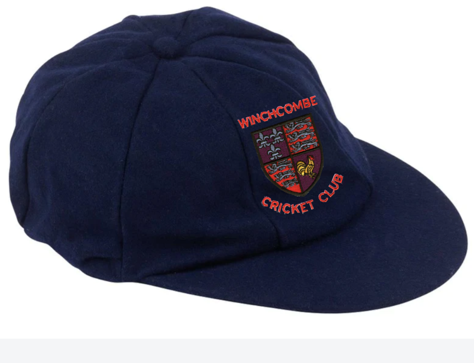 The Winchcombe CC Baggy Cap by Martin Berrill Sports is a navy blue cricket cap with the club logo and "Winchcombe Cricket Club" embroidered on the front, designed for a comfortable fit on various head sizes.