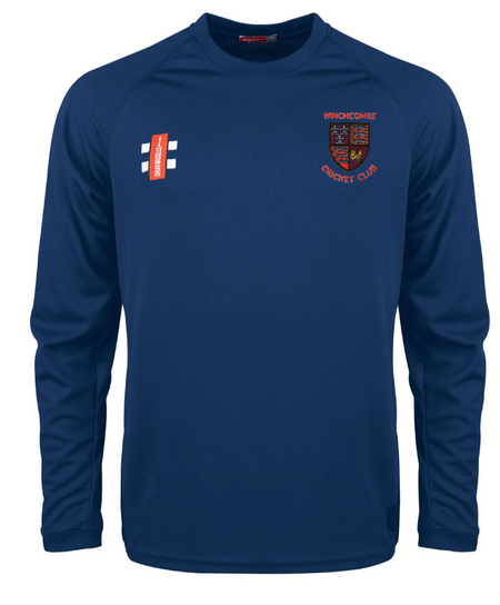 The Gray Nicolls Winchcombe CC Matrix V2 Long Sleeve T-Shirt in navy features a red and gold club crest on the left chest, a white and red logo on the right, crew neckline, and moisture-wicking fabric for all-match comfort.
