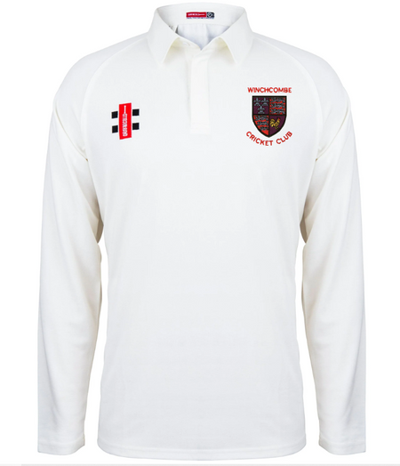 The Gray Nicolls Winchcombe CC Matrix V2 Long Sleeve Cricket Shirt is white with moisture control, a red and black Winchcombe CC crest on the left chest, and a small vertical black, white, and red logo on the right chest.