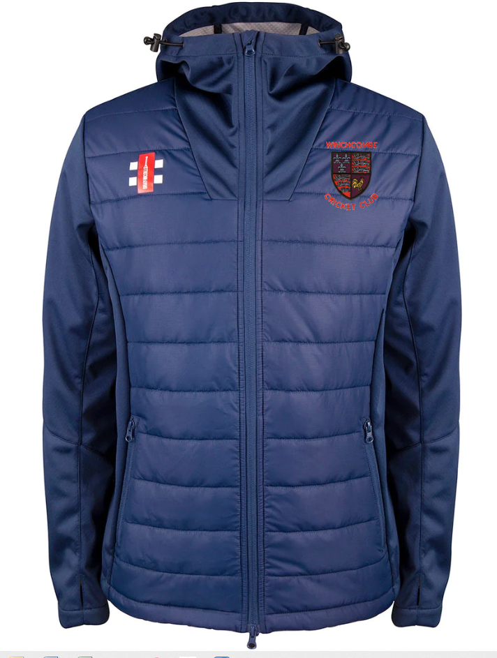 The Gray Nicolls Winchcombe CC Pro Performance Full Zip Jacket is a blue, water-repellent hooded jacket featuring the Warwickshire County Cricket Club crest on the left chest and an England cricket flag patch on the right, with stylish horizontal stitching.