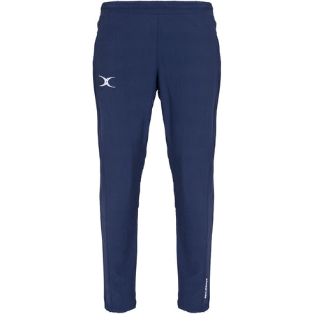 The Gilbert Womens Synergie V3 Trouser by Gilbert features a dark navy color, elastic waistband, white curved logo on the left thigh, and a small vertical white text logo near the ankle, shown against a white background.