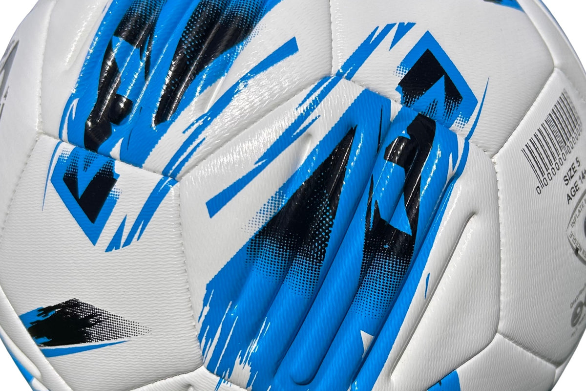 Close-up of the Samba Sports Samba Infiniti Max Training Ball, a white soccer ball featuring blue and black graphic patterns, with a textured surface, precision-moulded grooves, visible seams, and a partial barcode label.