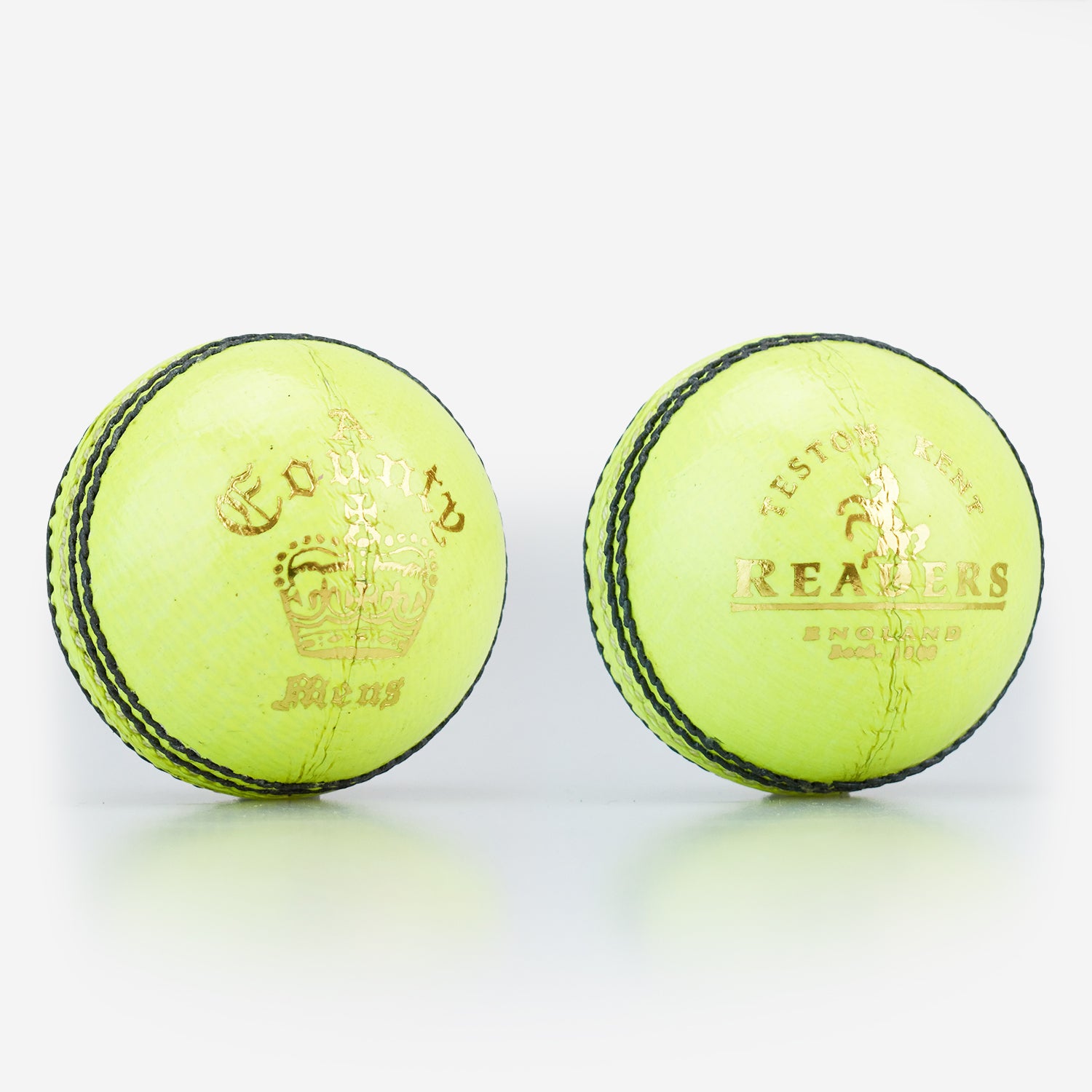 Two Readers County Crown Coloured Cricket Balls in yellow, featuring black stitching, gold text, and a crown logo from Readers, are placed side by side on a white background—ideal for evening matches or training sessions.