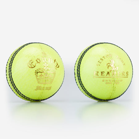 Two Readers County Crown Coloured Cricket Balls in yellow, featuring black stitching, gold text, and a crown logo from Readers, are placed side by side on a white background—ideal for evening matches or training sessions.