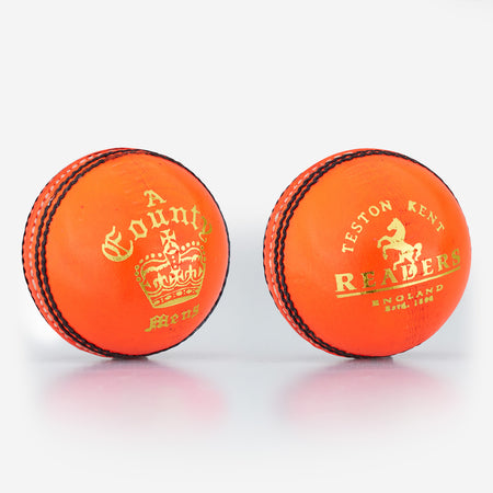 Two bright orange Readers County Crown Coloured Cricket Balls are shown, featuring black stitching and gold detailing. Ideal for evening matches or training, each ball is branded with the distinctive Readers name.