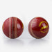 Two shiny red Kookaburra Super Coach Swinger leather cricket balls with white stitching—one shows the seam, while the other displays Kookaburra branding—ideal for swing training on a plain white background.
