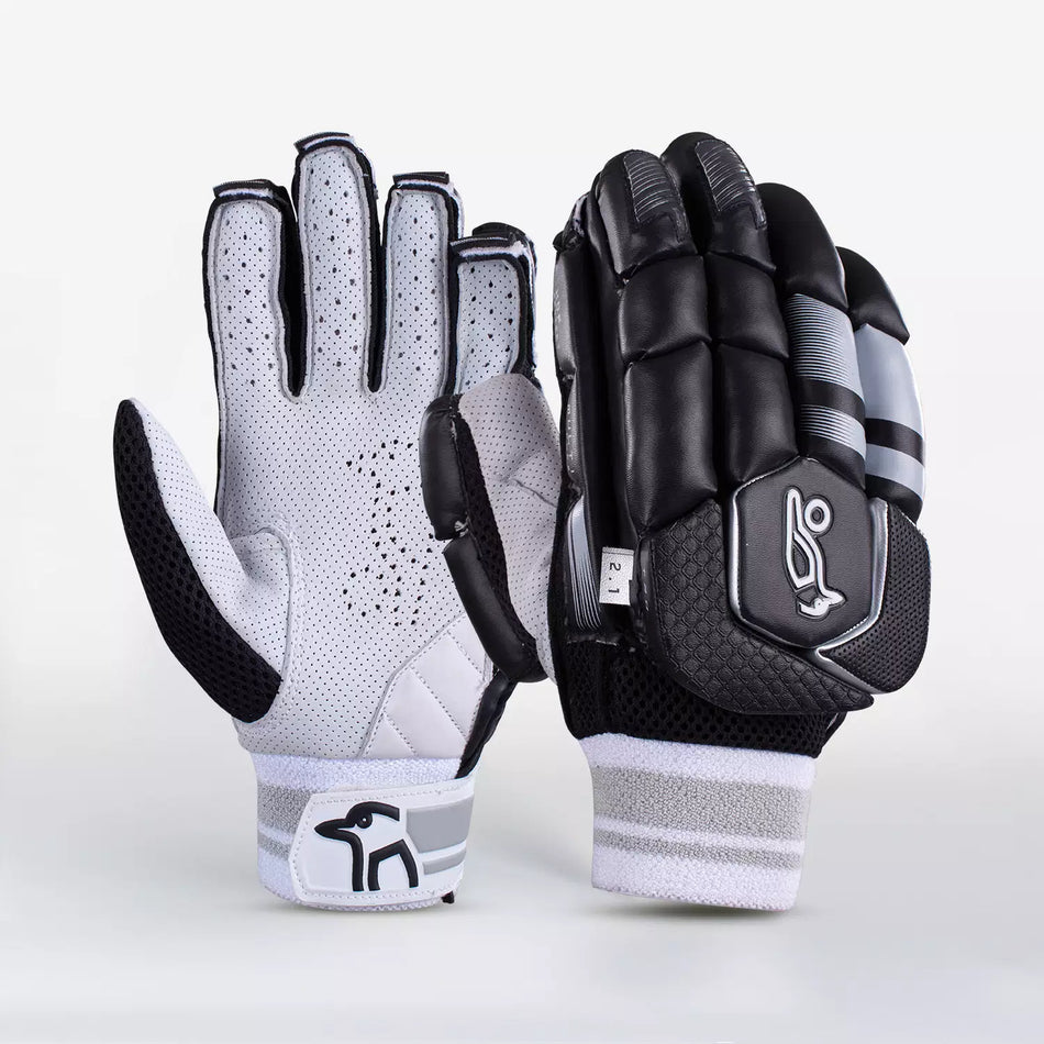 The Kookaburra 2.1 T/20 Batting Gloves by Kookaburra feature premium sheep leather palms, high-density foam padding, and a striking black design with grey and white details—offering both ventilation and protection for cricketers.
