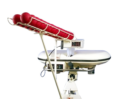 The Bola Automatic 28 Ball Feeder Unit by Bola features an automatic feeder and metal rack with four red balls, mounted on a white stand with control panels—ideal for solo batting practice, shown isolated on a white background.