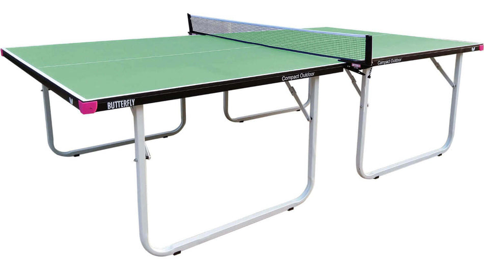 The Butterfly Compact Outdoor 10 Wheelaway Table Tennis Table is a green foldable outdoor table with a black frame, white legs, and an attached Butterfly Outdoor net and post set. The table, branded by Butterfly, is displayed in a ready-to-play position.