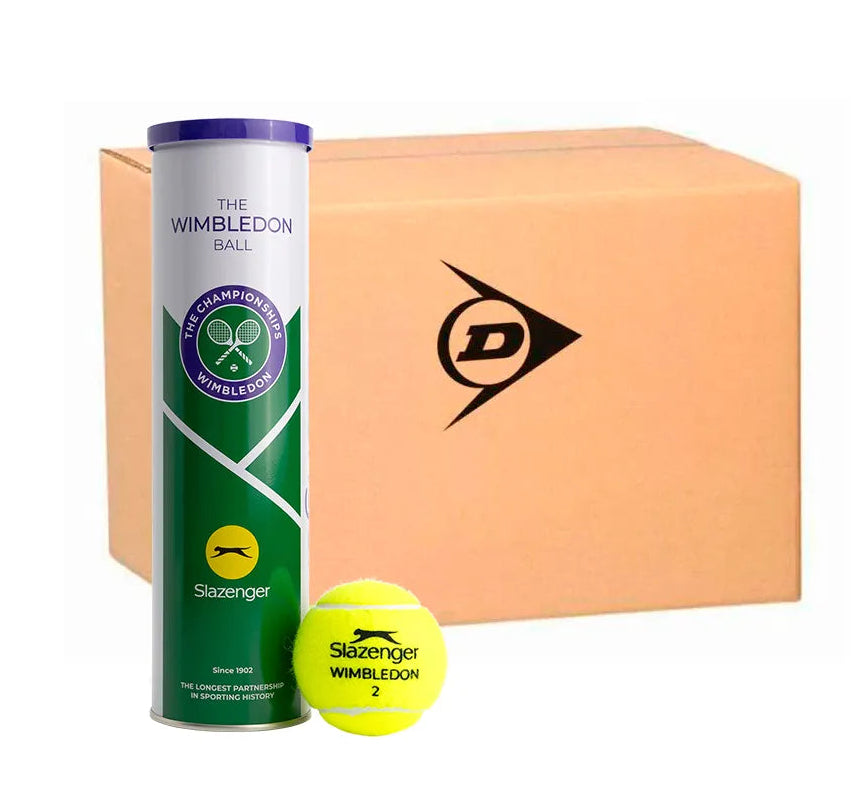 A Slazenger Wimbledon 4 Ball Tin from the six dozen balls (18 tins) pack is shown next to a loose yellow Slazenger tennis ball with a cardboard box in the background.