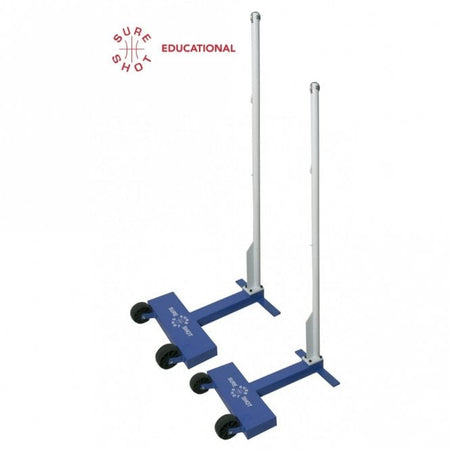Two blue and silver Sure Shot Educational Wheelaway Badminton Posts with steel uprights and wheels for easy transport are shown upright on a white background. The Sure Shot logo appears in the top left corner.