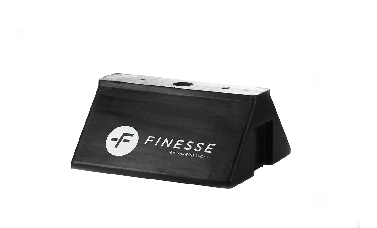 The Finesse Mannequin Base is a black, rectangular plastic base with a sloped front and white "FINESSE" branding, designed for agility poles or training mannequins. Shown against a plain white background.