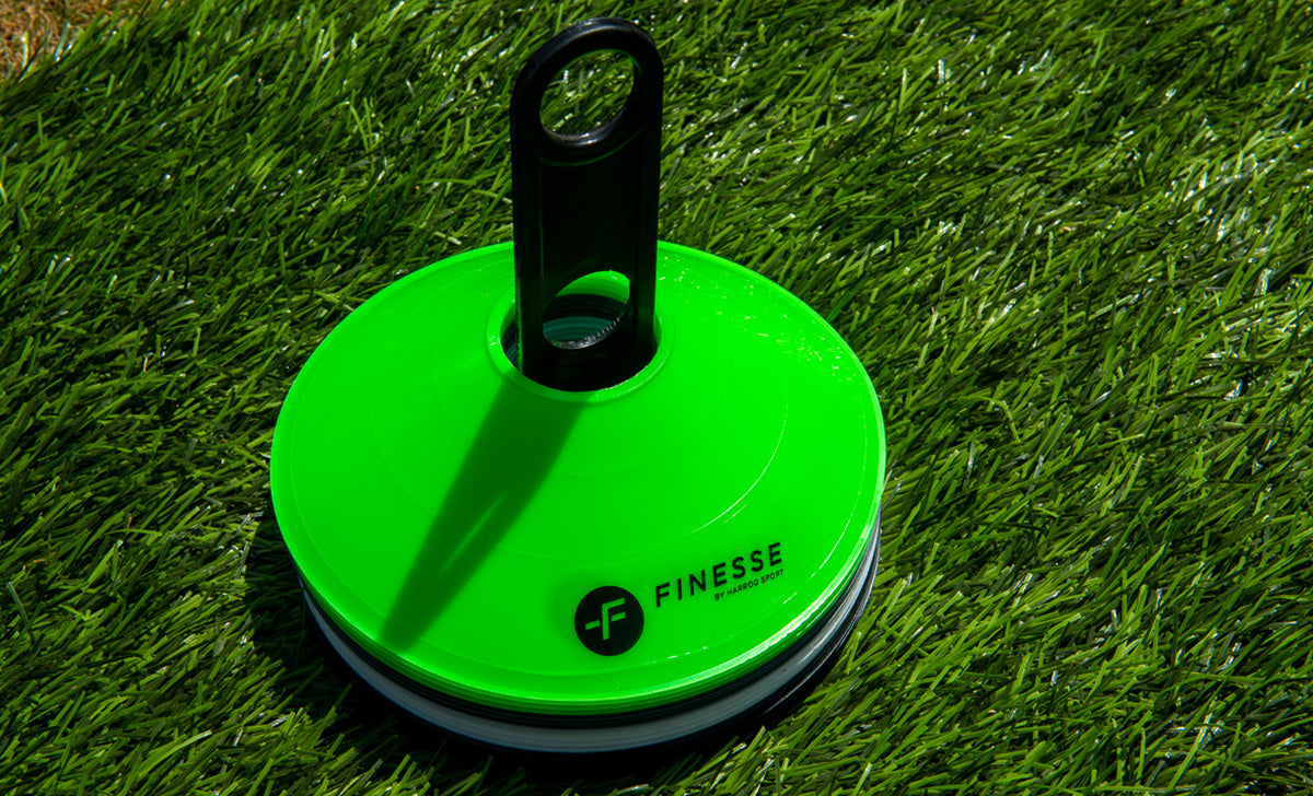 The Finesse Agility Bundle by Finesse features bright green cones with a black holder on artificial grass—ideal for speed ladder drills or agility hurdles and an essential addition to any training kit.