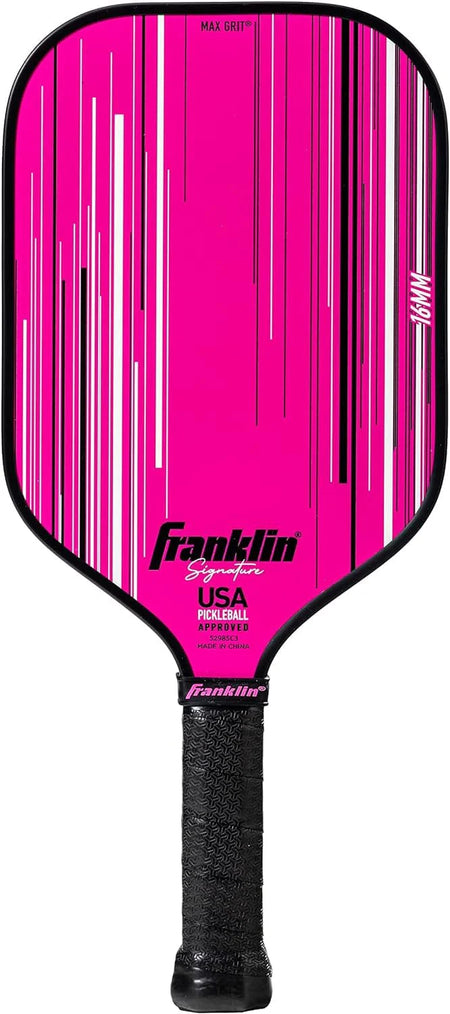 The Franklin Signature Pro Series Pickleball Paddle by Franklin features a bright pink color, USA Pickleball certified MaxGrit surface technology, white and black vertical lines, “MAX GRIT” at the top, and a black grip handle.