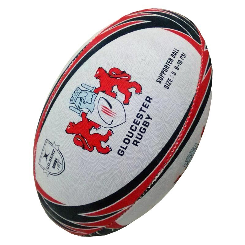 The Gilbert Gloucester Supporter Rugby Ball Size 5 (2023/2024 Logo) by Gilbert features a white base with red and black patterns, two red lions, a crest, and "Gloucester Rugby"—ideal for devoted fans.