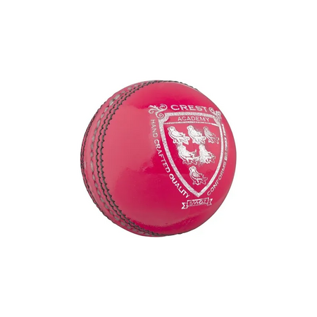 The Gray Nicolls Crest Academy Cricket Ball is a pink leather ball with visible machine-stitched seams and a white embossed crest logo featuring a shield and two lions.