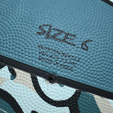 Close-up of the size 6 marking and inflation hole on a Blue/Black/Grey Midwest Street Basketball