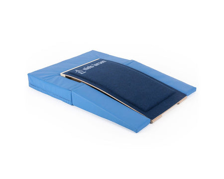 The Niels Larsen Springboard Full Surround for LRE020 is a blue gymnastics mat with a foam interior, raised carpeted ramp, and padded sides, designed by Niels Larsen for training and skill development.