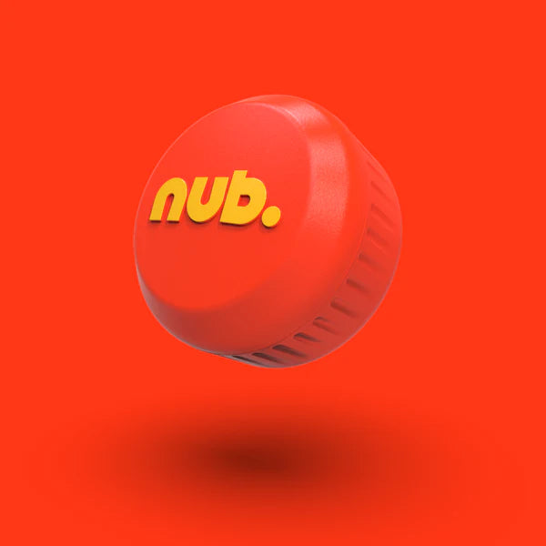 An orange bottle cap with "nub." in bold yellow letters, from nub Sports' Orange Scorch collection, floats against an orange background, resembling a silicone cricket bat grip and casting a soft shadow below.