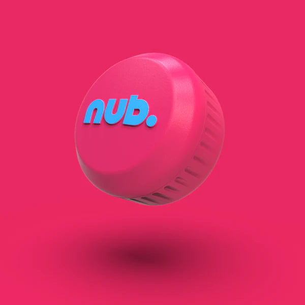 The nub Sports "nub - Pink Six" is a pink silicone bat grip bottle cap with blue "nub." branding, displayed floating over a solid pink background and a subtle shadow beneath it.