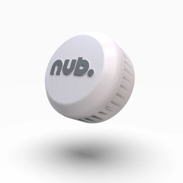 A white, round plastic bottle cap with "nub." embossed in gray lowercase letters, from nub Sports. The nub - White floats above a white surface with a soft shadow—resembling a sleek modern upgrade for cricket bat handles.