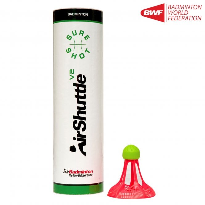 A cylindrical Sure Shot tube with green and black text stands beside a pink and green Sure Shot Outdoor Badminton Shuttle V2. The wind-resistant shuttle pack of 6 features the Badminton World Federation logo in the top right corner.