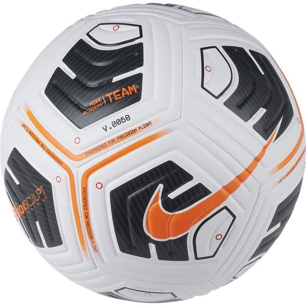 A close-up of the Nike Academy Team Football Size 5, by Nike, in White/Orange, shows black and orange geometric patterns, an orange swoosh, and "Nike Team" with "V.0058" printed on the surface.