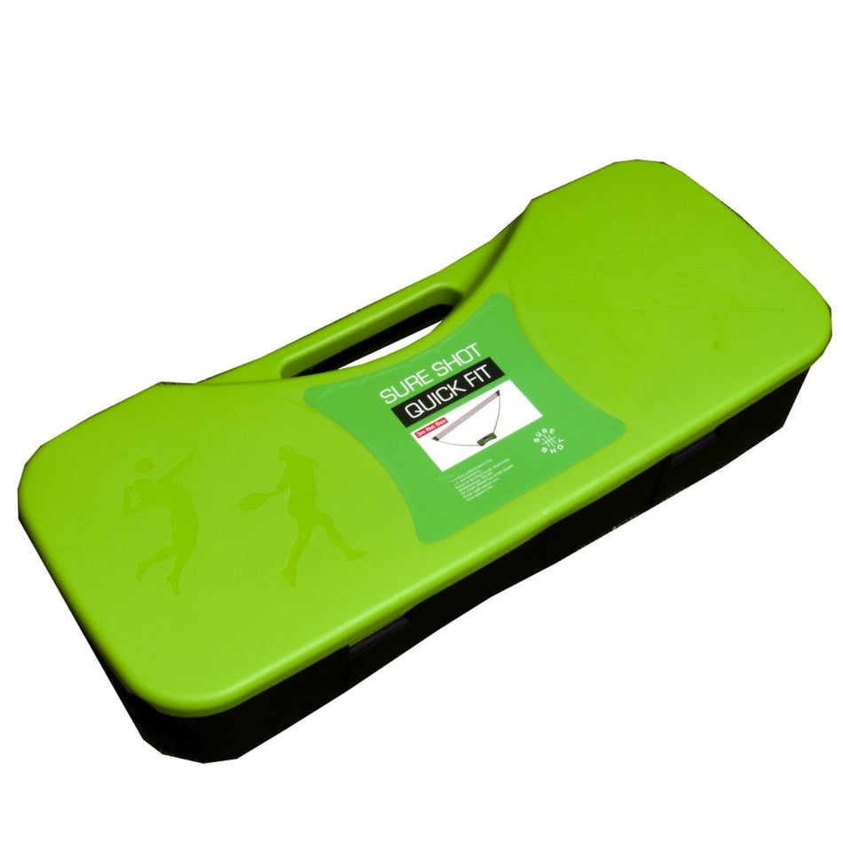 A green rectangular plastic carrying case with a black base and handle, featuring embossed athlete silhouettes. The label reads: Sure Shot Quick Fit Post and Net by Sure Shot—a portable badminton net perfect for fun in the garden.