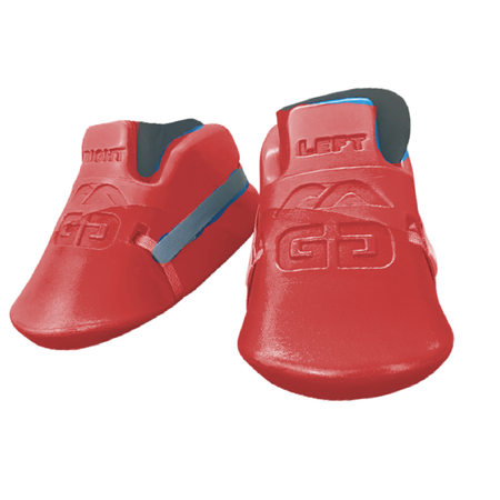 A pair of Mercian Genesis 3 Goalkeeping Kickers for Juniors in bright red with LEFT and RIGHT labels, blue straps, embossed GG logos, and a design similar to junior goalkeeper gear by Mercian, shown on a white background.